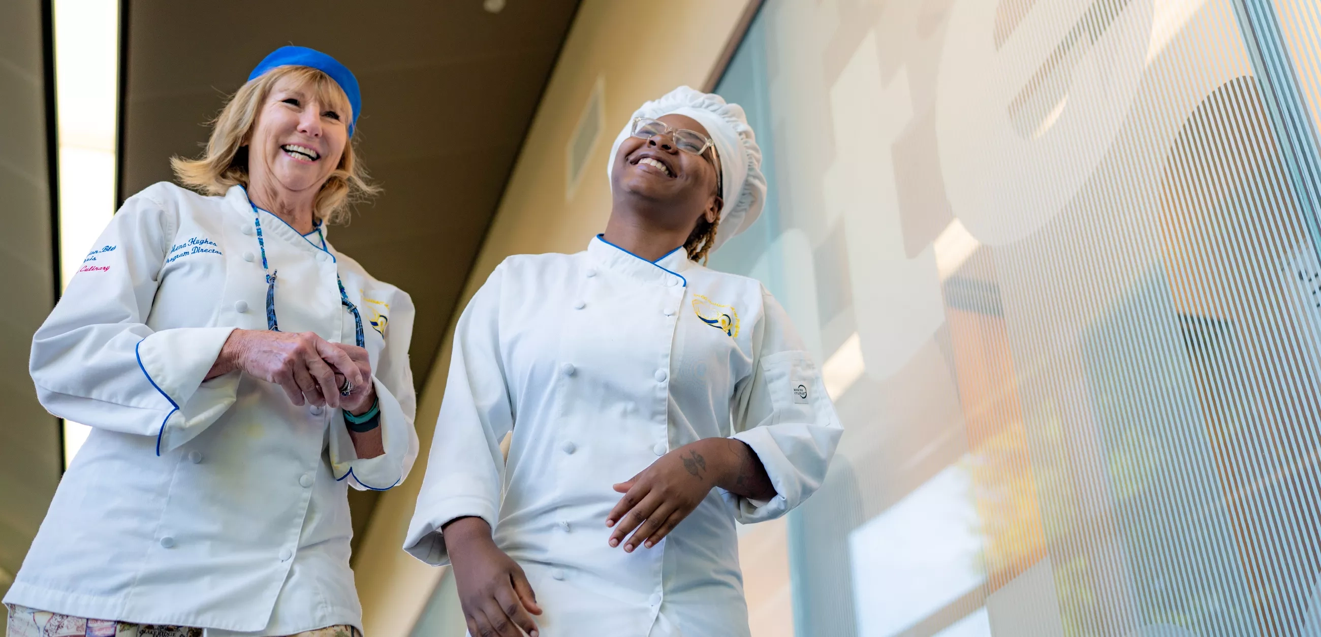 Two women in culinary outfits