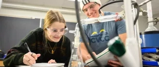 Two students in chemistry lab