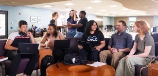 Group of students seated and laughing