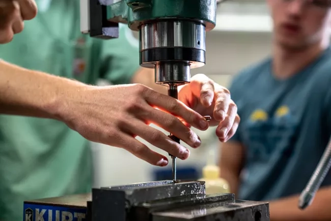 Hands of Male Machine Tool Student