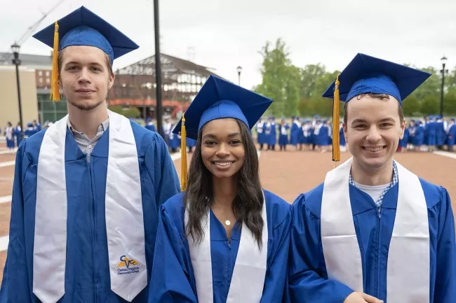 smiling group of graduates of mixed ethnicity