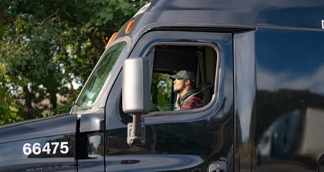 Man driving a tractor trailer